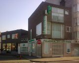 Farmacia y tienda de alimentación, Ostende, Bélgica (1948)